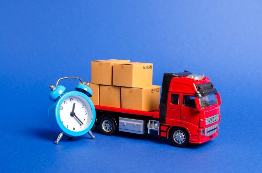 a-red-truck-with-cardboard-boxes-and-a-blue-alarm-single-point-capital-1024x678