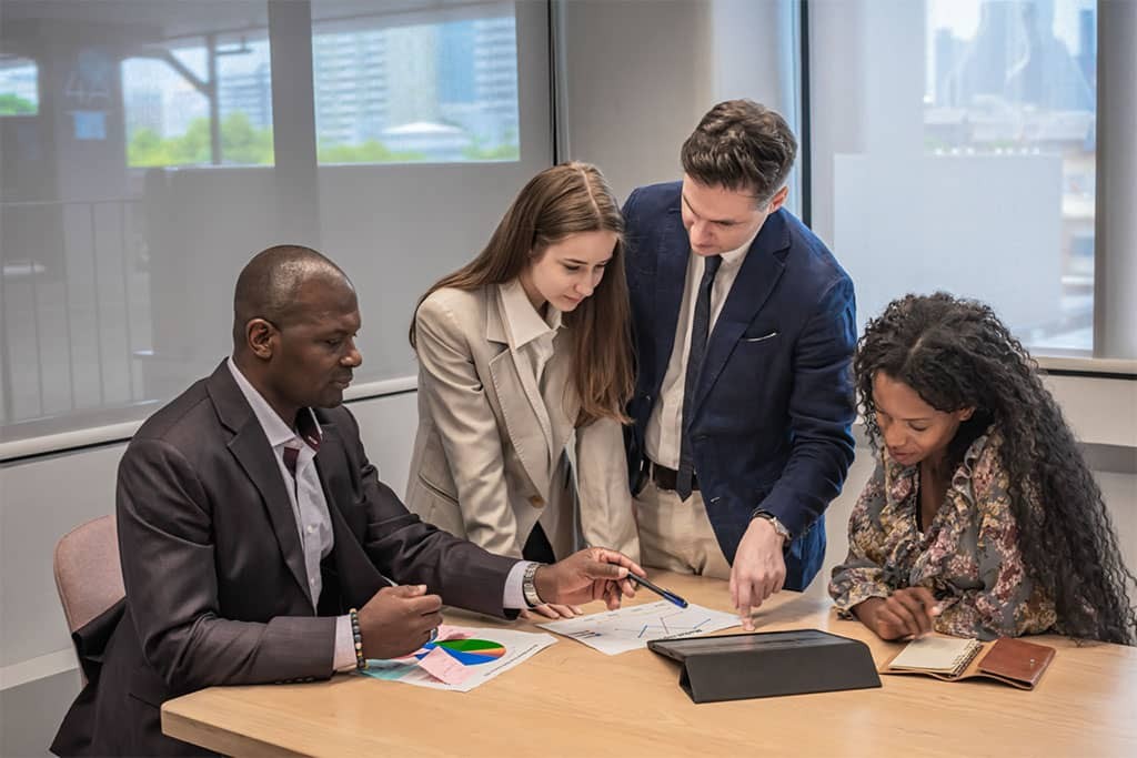 business-people-meeting-and-look-tablet-for-discuss-in-modern-office