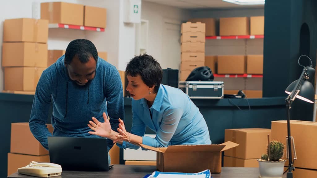 two-entrepreneurs-checking-supply-chain-on-storehouse