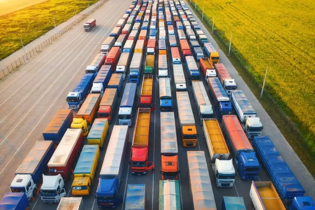 aerial-view-of-colorful-trucks-in-terminal-at-suns