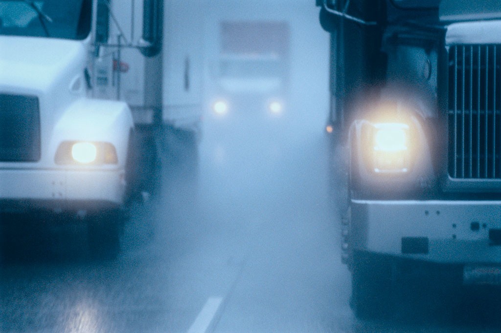 partial-view-of-large-commercial-truck-driving-in-2022-03-04-02-09-30-utc-scaled