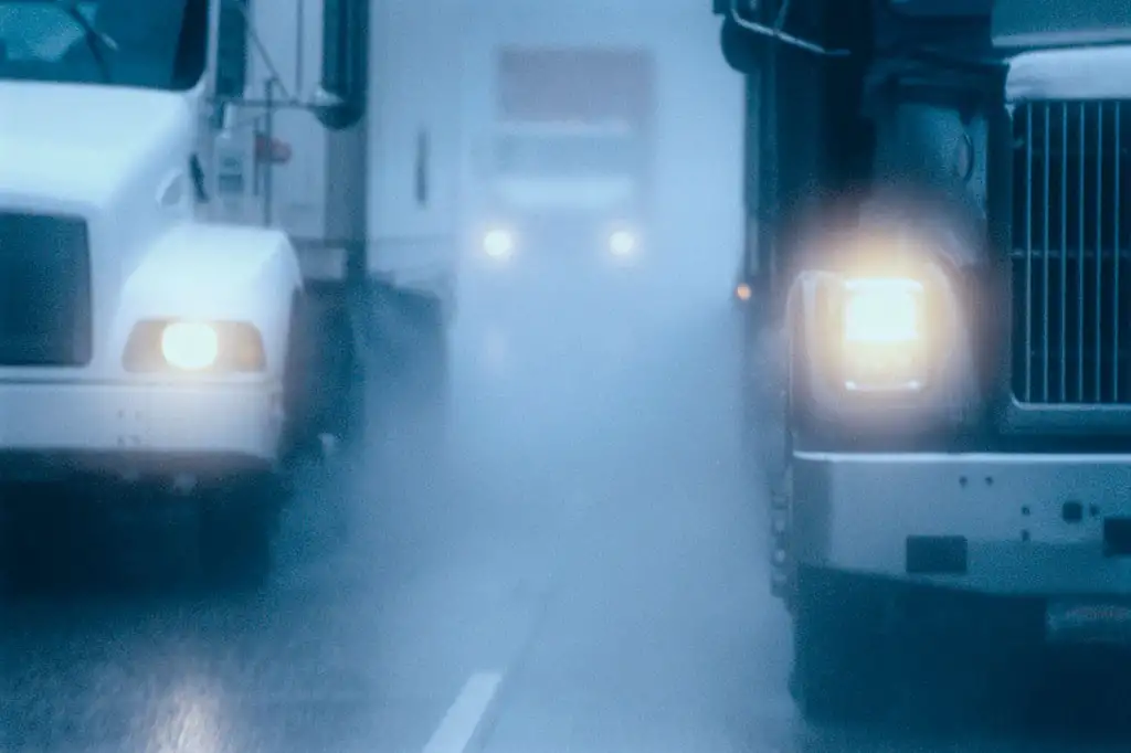 partial-view-of-large-commercial-truck-driving-in-2022-03-04-02-09-30-utc-scaled