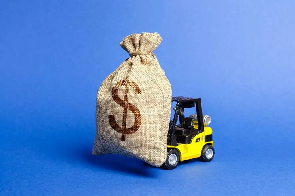 yellow-forklift-truck-carries-a-big-bag-of-money-2022-11-09-06-35-42-utc-scaled-uai-2544x1696