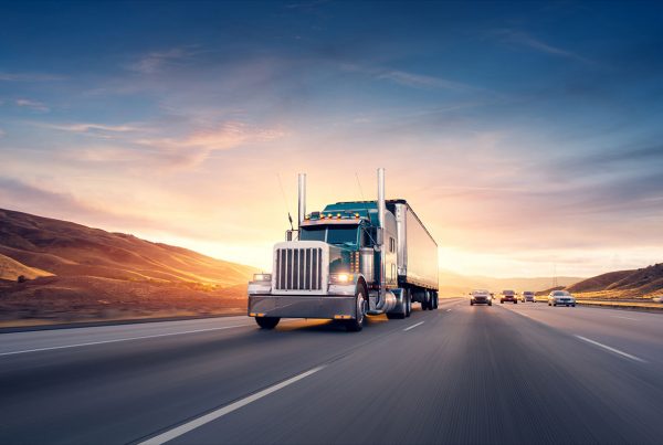 Logistics-Truck Driving Down Highway