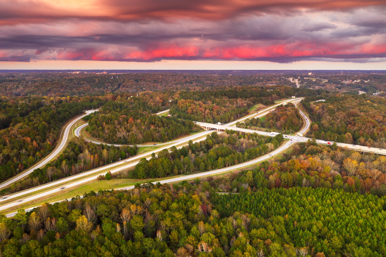 Roads and highway junctions surrounded by autumn foliage.